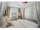 Cozy bedroom featuring a decorative four-poster bed, curtains, and a ceiling fan at 330 Horton Grove Rd, Fort Mill, SC 29715