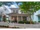 Lovely two-story home with a classic white exterior, covered porch, and well-manicured landscaping at 330 Horton Grove Rd, Fort Mill, SC 29715