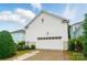 Detached two-car garage featuring white siding, landscaping, and a paved driveway at 330 Horton Grove Rd, Fort Mill, SC 29715