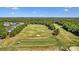 Aerial view of a well-maintained golf course with lush greenery and neighborhood in the background at 330 Horton Grove Rd, Fort Mill, SC 29715