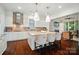 Modern kitchen featuring stainless steel appliances, tile backsplash, and bar stool seating at 330 Horton Grove Rd, Fort Mill, SC 29715