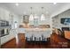 Bright kitchen has island seating, modern appliances, and access to a fireplace in the adjacent room at 330 Horton Grove Rd, Fort Mill, SC 29715