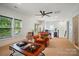 Spacious living room with natural light, comfortable leather seating, and views of the outdoors at 330 Horton Grove Rd, Fort Mill, SC 29715
