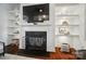 Living room showcases a fireplace, floating shelves, and a mounted TV at 330 Horton Grove Rd, Fort Mill, SC 29715