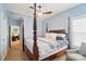 This primary bedroom features a four-poster bed, ceiling fan, and soft natural light at 330 Horton Grove Rd, Fort Mill, SC 29715