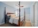 Comfortable bedroom showcasing a four-poster bed with stylish bedding and soft lighting at 330 Horton Grove Rd, Fort Mill, SC 29715