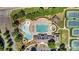 Aerial view of a luxurious community pool area, equipped with a splash pad, swimming pool, and lounge chairs at 330 Horton Grove Rd, Fort Mill, SC 29715