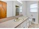 Well-lit bathroom featuring a vanity with a beige countertop and a separate shower stall at 335&315 Graham Rd, Mt Ulla, NC 28125