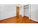 Cozy bedroom with gleaming hardwood floors and closet space for ample storage at 335&315 Graham Rd, Mt Ulla, NC 28125