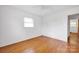 Bright bedroom with hardwood floors, a ceiling fan, and a window offering natural light at 335&315 Graham Rd, Mt Ulla, NC 28125