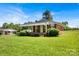 Inviting brick home featuring a covered porch and well-maintained landscaping, blending classic design with welcoming curb appeal at 335&315 Graham Rd, Mt Ulla, NC 28125