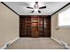 Bright living room showcasing a large, dark-stained bookshelf and soft natural light at 335&315 Graham Rd, Mt Ulla, NC 28125