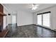 Spacious living room with brick fireplace, white paneling, and double doors leading to the outside at 335&315 Graham Rd, Mt Ulla, NC 28125