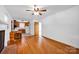 Spacious living room featuring hardwood floors, a fireplace, and an open view to the kitchen at 335&315 Graham Rd, Mt Ulla, NC 28125