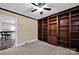 Office area featuring a spacious dark wood bookshelf, carpet and a ceiling fan at 335&315 Graham Rd, Mt Ulla, NC 28125