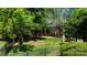 Spacious backyard with raised garden beds, a small gazebo, and a wood fence at 3617 Ruth St, Indian Trail, NC 28079