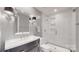 Contemporary bathroom featuring a sleek vanity, and a glass-enclosed shower with modern fixtures at 3617 Ruth St, Indian Trail, NC 28079