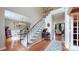Grand foyer with hardwood floors, staircase, and views into the dining and living areas at 3617 Ruth St, Indian Trail, NC 28079