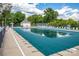 Large community pool covered for the off-season, surrounded by lounge chairs for relaxation at 3617 Ruth St, Indian Trail, NC 28079