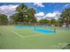 Enjoy a game of tennis at the community tennis courts with well-maintained green and blue playing surface at 3617 Ruth St, Indian Trail, NC 28079
