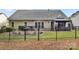 Fenced backyard featuring a hot tub, patio, and well-maintained lawn at 3820 Leela Palace Way, Fort Mill, SC 29708
