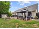 Expansive backyard with a gazebo, hot tub, and lush greenery, creating a private outdoor oasis at 3820 Leela Palace Way, Fort Mill, SC 29708
