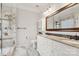 Luxurious bathroom featuring a glass-enclosed shower, double vanity, and marble tile flooring at 3820 Leela Palace Way, Fort Mill, SC 29708