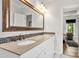 Bathroom featuring a double vanity with granite countertop, decorative backsplash, and bronze fixtures at 3820 Leela Palace Way, Fort Mill, SC 29708