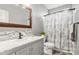 Stylish bathroom featuring a marble vanity, mosaic backsplash, and a shower with a decorative curtain at 3820 Leela Palace Way, Fort Mill, SC 29708