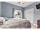 Comfortable bedroom with a large window, plush bedding, and a view of the outdoors at 3820 Leela Palace Way, Fort Mill, SC 29708
