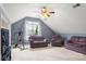 Upstairs bonus room with comfortable seating, a ceiling fan, and scenic views at 3820 Leela Palace Way, Fort Mill, SC 29708