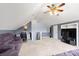 Versatile bonus room with angled ceilings, perfect for a home office or media center setup at 3820 Leela Palace Way, Fort Mill, SC 29708