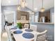 Open-concept dining room features a long table with decor and modern cabinets at 3820 Leela Palace Way, Fort Mill, SC 29708