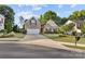 Charming two-story brick home with a well-manicured lawn and a two-car garage at 3820 Leela Palace Way, Fort Mill, SC 29708