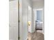 Bright hallway with hardwood floors leading to a bedroom, showcasing clean lines and neutral tones at 3820 Leela Palace Way, Fort Mill, SC 29708