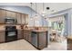 Open kitchen boasts stylish backsplash, stainless steel dishwasher and modern appliances at 3820 Leela Palace Way, Fort Mill, SC 29708