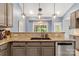 Modern kitchen featuring granite countertops, stylish lighting, and stainless steel dishwasher at 3820 Leela Palace Way, Fort Mill, SC 29708