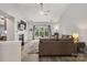 Spacious living room featuring vaulted ceilings, a cozy fireplace, and a large window with backyard views at 3820 Leela Palace Way, Fort Mill, SC 29708