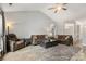 Spacious living room featuring a vaulted ceiling, fan, and ample seating space at 3820 Leela Palace Way, Fort Mill, SC 29708