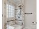 Elegant glass-enclosed shower with marble accents, a built-in seat, and modern fixtures at 3820 Leela Palace Way, Fort Mill, SC 29708