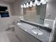 Renovated bathroom with double sink vanity, granite countertop, and modern lighting at 404 Kings Dr # 7, Cherryville, NC 28021