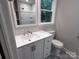 Bathroom with a modern vanity, sleek fixtures, bright lighting, and a framed mirror providing a polished design at 404 Kings Dr # 7, Cherryville, NC 28021