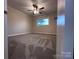 Bedroom with plush carpeting, ceiling fan, and ample natural light that enhance the home's inviting atmosphere at 404 Kings Dr # 7, Cherryville, NC 28021
