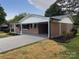A single-story brick home with a convenient carport and well-maintained landscaping at 404 Kings Dr # 7, Cherryville, NC 28021