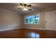Bright living room featuring hardwood floors, a ceiling fan, and a large picture window at 404 Kings Dr # 7, Cherryville, NC 28021