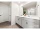 Bathroom with double vanity, quartz countertop, large mirror, and tile floors at 446 Misty Law Ln, Clover, SC 29710