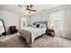 Cozy bedroom features carpet, neutral walls, ceiling fan, and natural light from windows at 446 Misty Law Ln, Clover, SC 29710