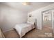 Cozy bedroom features plush carpet, neutral walls, and a comfortable bed with stylish bedding at 446 Misty Law Ln, Clover, SC 29710