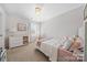 Cozy bedroom featuring neutral carpet, window, and a comfortable bed at 446 Misty Law Ln, Clover, SC 29710