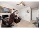 Cozy bedroom with carpeted floors, a ceiling fan, and a comfortable chair at 446 Misty Law Ln, Clover, SC 29710